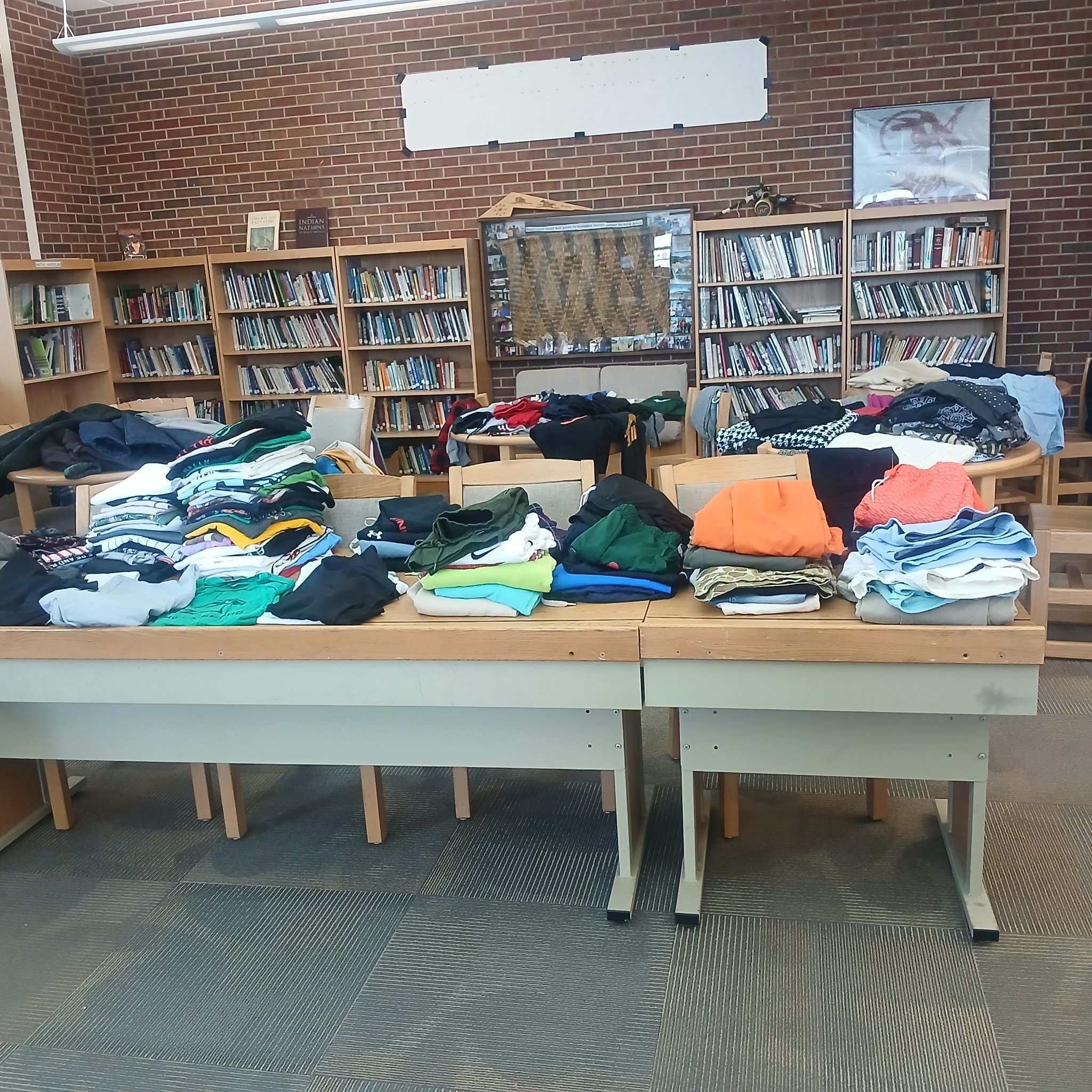 Clothing donation tables in library