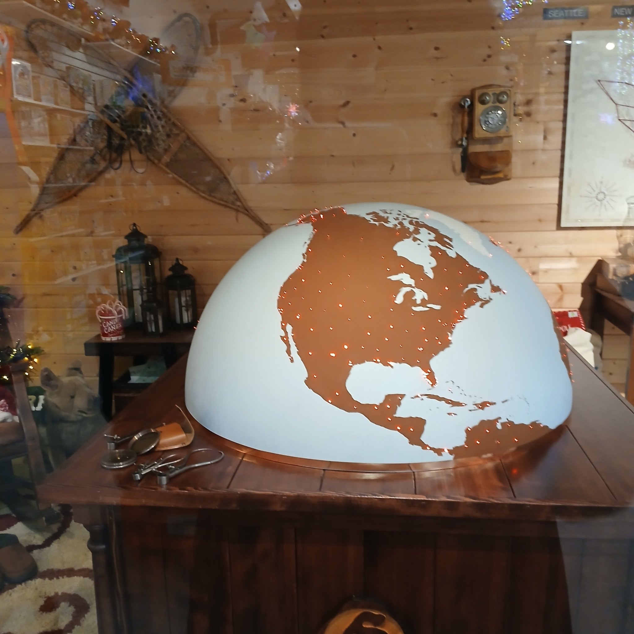 Large decorative globe showing North America in Santa's workshop at North Pole, Alaska