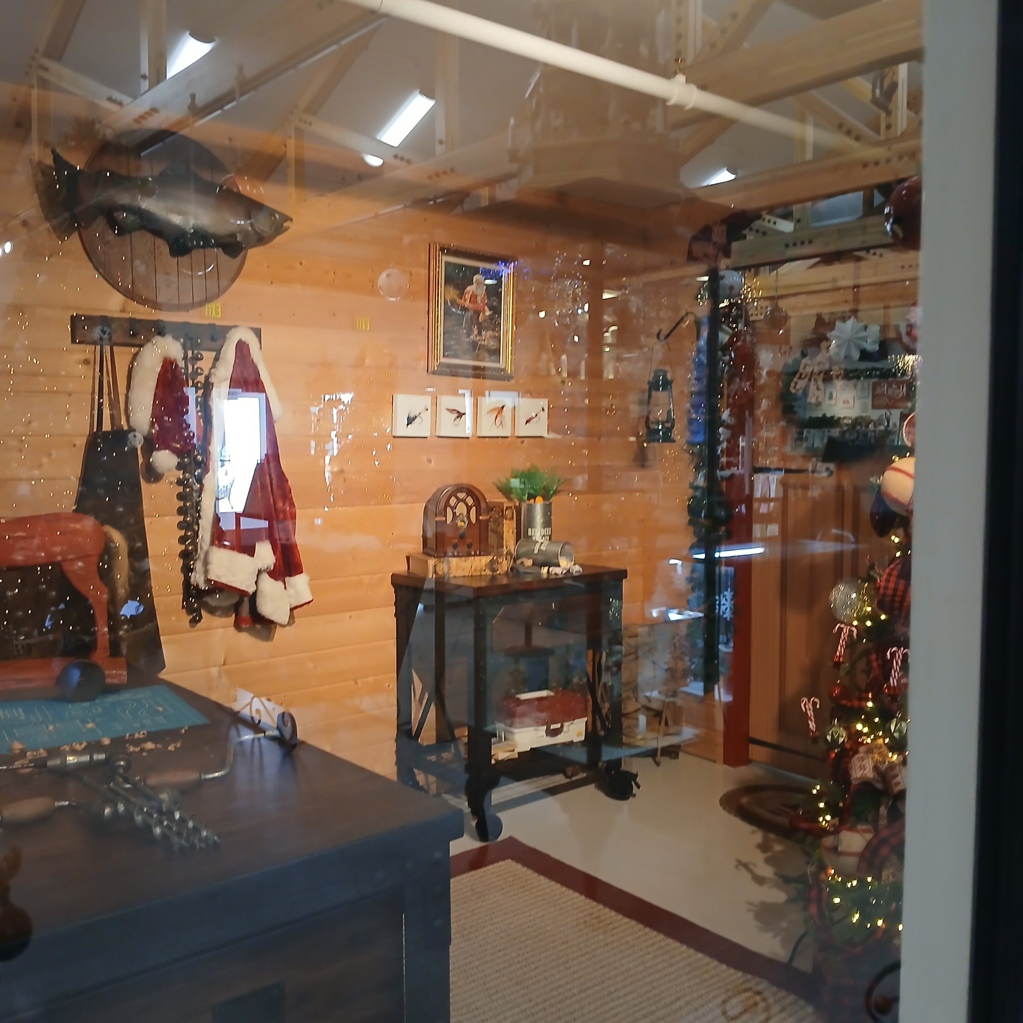 Santa's coat and suit hanging in cabin room at North Pole, Alaska
