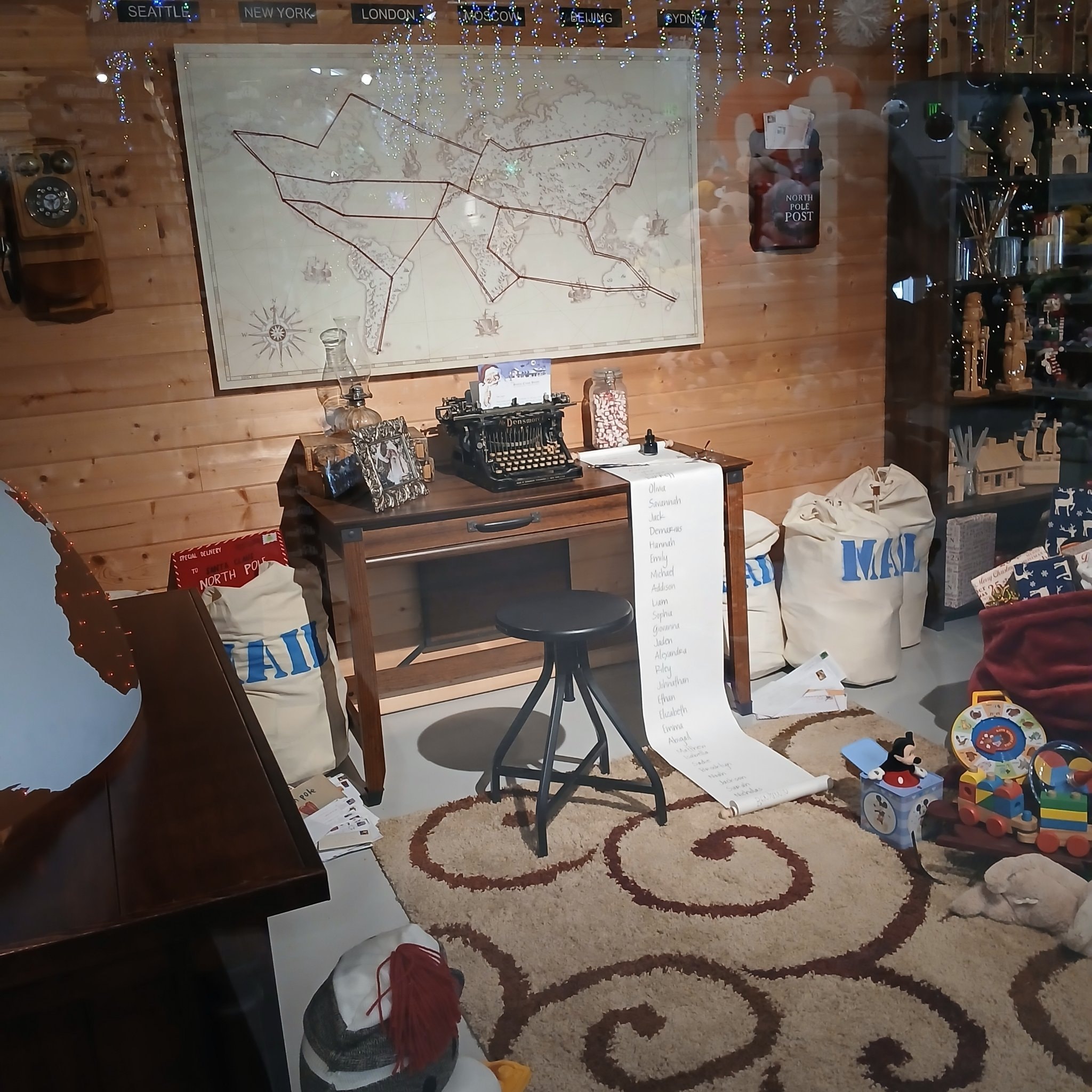 Santa's desk with typewriter, naughty and nice list, and mail bags at North Pole, Alaska