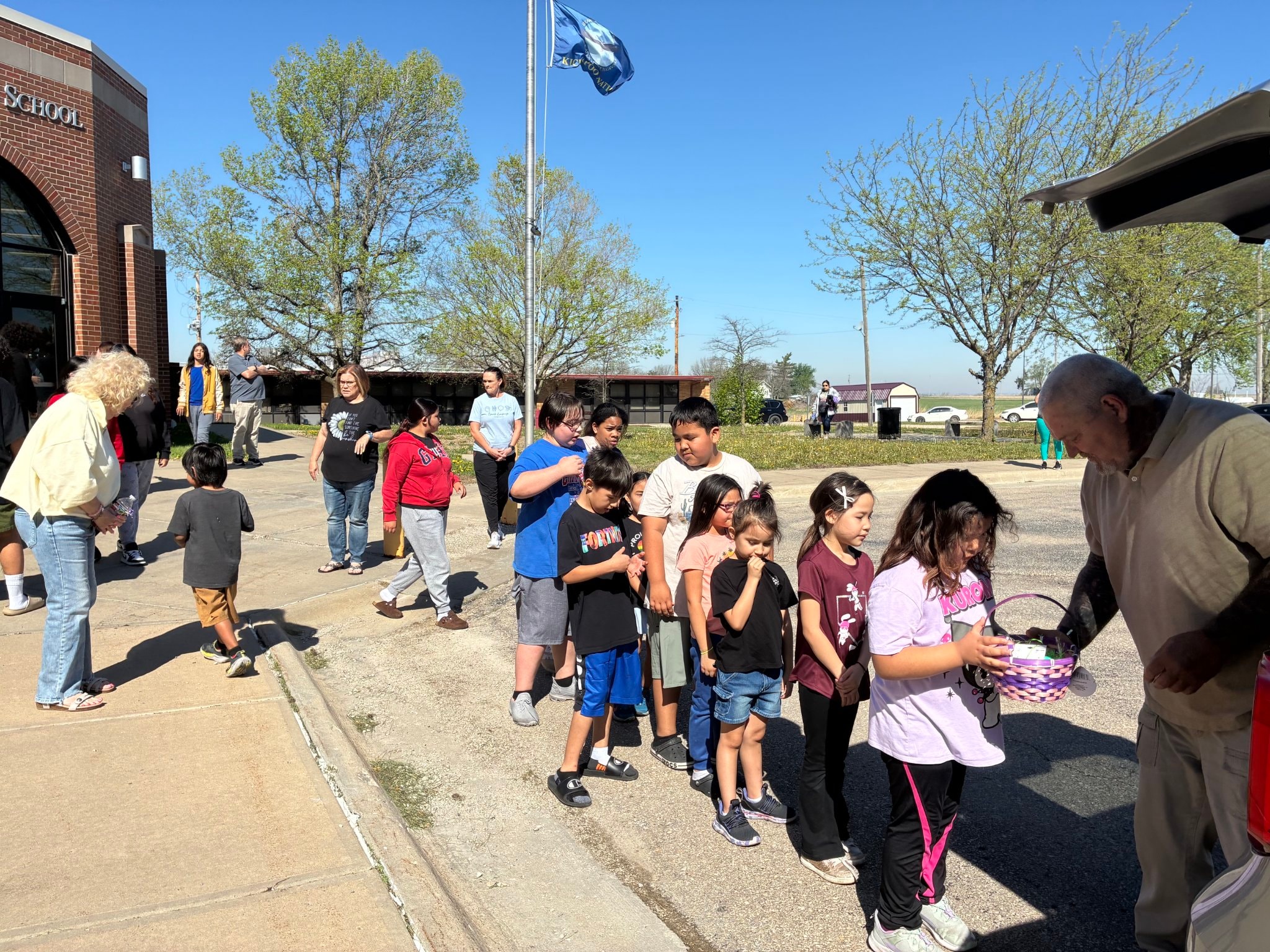 Easter baskets and school children at community event