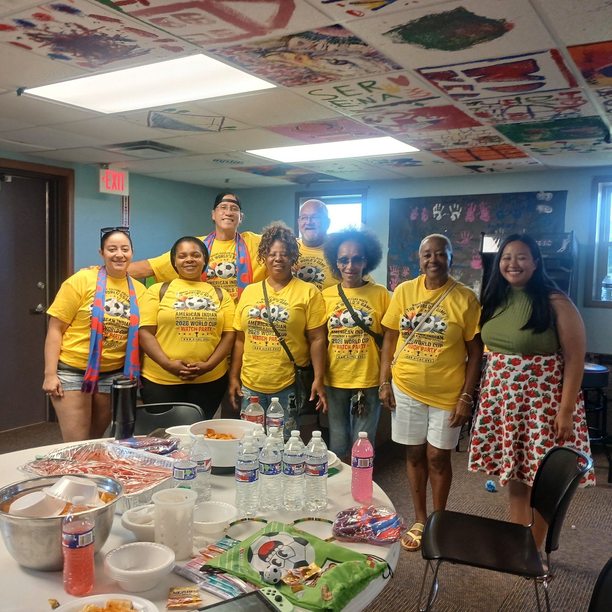 2026 World Cup Watch Party group in yellow AIEBC shirts